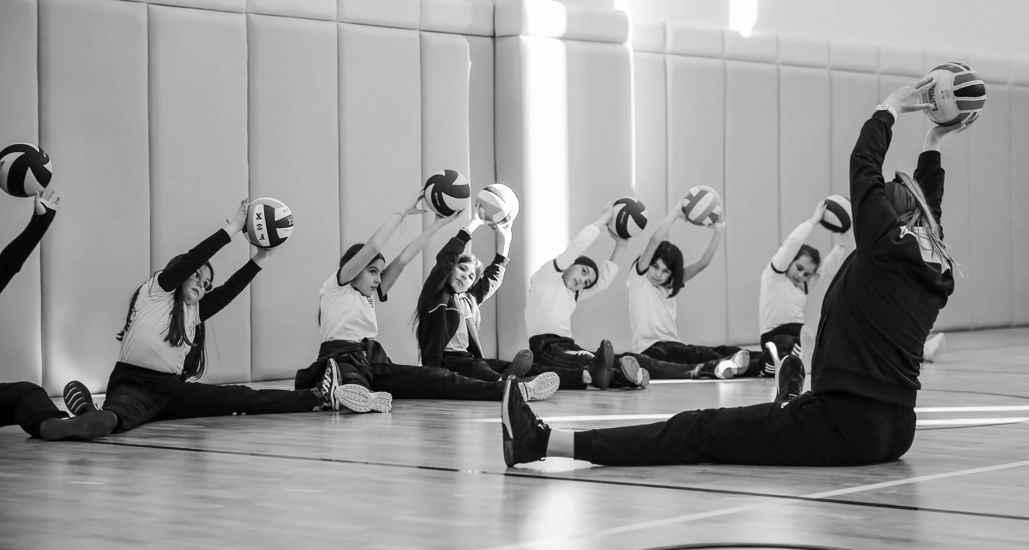 coach stretching with kids